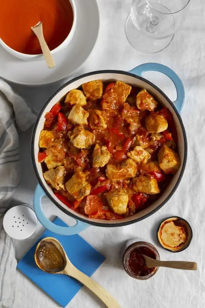 Easy chicken stew with bell peppers in a Dutch oven, healthy family dinner recipe